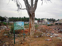 Signs of times: All that remains of Janardhanakere is this board. DH Photo