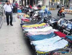 Hindrance: Hawkers have encroached on the pavement near the Indiranagar Metro Station.
