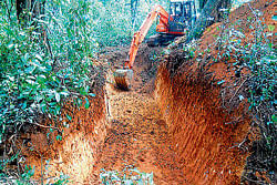 Trenches dug by villagers of Ainekidu village to avoid the onslaught of wild elephants, near Subramanya. dh photo