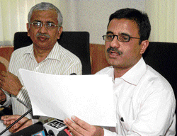 Chief Electoral Officer Anil Kumar Jha (right) speaks at a press conference in Bangalore on Thursday. Joint Chief Electoral Officer Shyamaiah is with him. dh photo