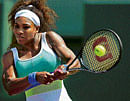 sizzling in the heat: Serena Williams returns during her crushing win over Flavia Pennetta on Thursday. AFP