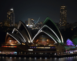A view of Australia's iconic landmark Sydney Opera House during the annual Earth Hour on March 23, 2013. One minute brightly lit, the next plunged into darkness -- iconic landmarks around the world will cut their lights Saturday for the 'Earth Hour' campaign against climate change. AFP PHOTO