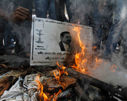 College students burn a poster of Sri Lanka's President Mahinda Rajapaksa during a protest in the southern Indian city of Chennai. Reuters Image