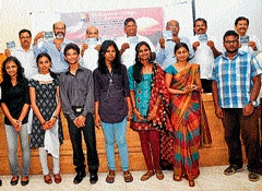 Mangalore Today Editor and Publisher V U George releasing the documentary in St Aloysius campus in Mangalore. College Principal Fr Swebert DSilva and the students who produced the documentary among others look on. DH&#8200;photo