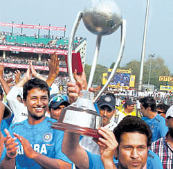 Sachin Tendulkar lifts the trophy after Indias victory against Australia in New Delhi. PTI  photo