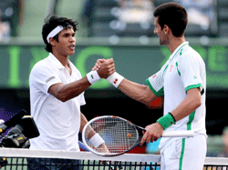 Somdev Dewarman of India congratulates Novak Djokovic of Serbia after thier match during the Sony Open at Crandon Park Tennis Center on March 24, 2013 in Key Biscayne, Florida. Matthew Stockman/Getty Images/AFP