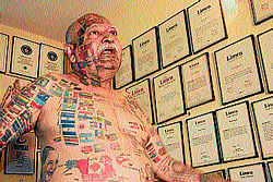 Determined: Har Prakash Rai has tattooed his body with flags of 366 countries.
