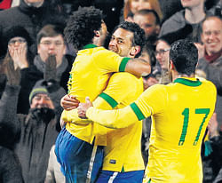 SAVIOUR Brazil's Fred (centre) celebrates after scoring the equaliser against Russia on Monday. AFP photo