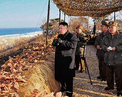 North Korean leader Kim Jong-Un (C) inspects the landing and anti-landing drills of KPA Large Combined Units 324 and 287 and KPA Navy Combined Unit 597 at an undisclosed  location on Monday. AFP photo photo