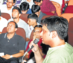 Challenging: Quiz master Nitish Khadiya interacting with the participants.