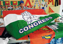 Poll profit : A vendor in Bangalore does a brisk business selling buntings and other election paraphernalia of various political parties. DH Photo