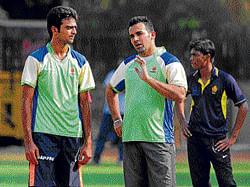 Learning from master: Royal Challengers Bangalores Jaydev Unadkat (left) is all ears as veteran Zaheer Khan imparts a few tips during a training session on Wednesday. DH photo