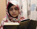 In this undated file photo provided by Queen Elizabeth Hospital in Birmingham, England, Malala Yousufzai, the 15-year-old girl who was shot at close range in the head by a Taliban gunman in Pakistan, reads a book as she continues her recovery at the hospital. doctors said Wednesday, Jan. 30, 2013, that Yousufzai is headed toward a full recovery once she undergoes a final surgery to reconstruct her skull. AP Photo