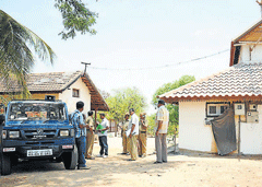 A DH file photo of Nazarbad police taking stock of things at taxidermist Van Ingens bungalow, in Mysore.