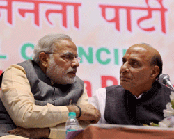 File Photo - BJP President Rajnath Singh with Gujarat CM Narendra Modi. Narendra Modi on Sunday has been re-inducted in the BJP Parliamentary Board. PTI Photo