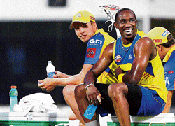 Calm before storm: Dwayne Bravo (right) and Jason Holder relax during Chennai Super Kings practice session at the MA&#8200;Chidambaram stadium on Monday. AP