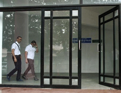 Italian sailors Salvatore Girone and Massimiliano Latorre (L) walk inside the police commissioner office building in Kochi September 4, 2012.