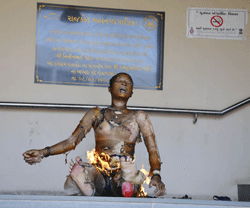 A protester self-immolates at the municipal corporation office at Rajkot in Gujarat. Photo by Reuters.