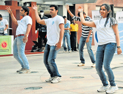Members of the Bangalore Political Action Committee perform a jig to create awareness on the importance of voting in Bangalore on Sunday. dh Photo