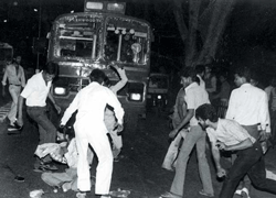 A Sikh man being surrounded and beaten by a mob. Wikipedia Image