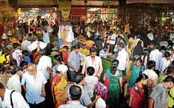 FESTIVE The markets are abuzz with people buying neem and mango leaves for the festival. dh photo by srikanta sharma r