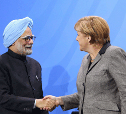 Prime Minister Manmohan Singh shakes with German Chancellor Angela Merkel during a joint press confernce at the Federal Chancellery in Berlin on Thursday. PTI Photo