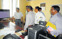 Expenditure Observer Shashi Saklani visits the office of Media Certification and Monitoring Committee, at Madikeri on Friday. Returning officer of Madikeri Assembly constituency G Prabhu and MCMC member N M Shashikumar look on.