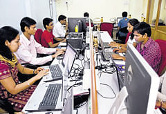 BIGGER STEP: Software programmers develop applications at the MoFirst Solutions office in Mumbai.