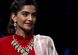 Sonam Kapoor displays jewelry during the India Gem and Jewelry Fair in New Delhi, India, Friday, April 12, 2013. (AP Photo