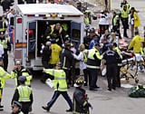 Medical workers aid injured people at the finish line of the 2013 Boston Marathon in Boston, Monday, April 15, 2013. Two bombs exploded near the finish line of the Boston Marathon on Monday, killing at least two people and injuring dozens of others (AP Photo