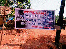 A poster announcing villagers decision to ban voting. DH photos