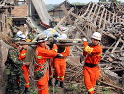 Rescuers carry out an elderly person from a collapsed house after a strong 6.6 magnitude earthquake hit Qingren township of Lushan county, Sichuan province April 20, 2013. China's worst earthquake in three years on Saturday killed at least 157 people and injured more than 5,700, the Ministry of Civil Affairs said. The quake struck a remote mountainous area of Lushan county, near the city of Ya'an, at a depth of 12 km (7.5 miles), the U.S. Geological Survey said. Picture taken April 20, 2013. REUTERS