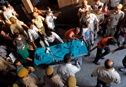 A five-year-old rape victim is moved to the All India Institute of Medical Sciences hospital from Swami Dayanand hospital for treatment in New Delhi April 19, 2013. The girl's rape by a male neighbour, according to the police, triggered an angry protest march on the Swami Dayanand hospital in the Indian capital, by her relatives and political activists on Friday, reawakening concerns about women's safety in the country. REUTERS