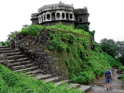 Majestic remains (Top) The lush green foliage surrounding the Daulatabad fort; (above) one of the gates of the fort.