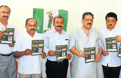 JD(S) leader A Sadananda Shetty releases the district party manifesto at the newly inaugurated JD(S) election office  in Mangalore on Saturday. Partys Mangalore South candidate S P Changappa and others are seen. dh photo
