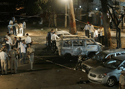 National Investigative Agency (NIA) officers investigate at the blast site after an explosion near the BJP office at Malleswaram in Bengaluru on Wednesday. PTI Photo