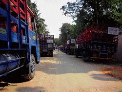 Trucks loaded with LPG cylinders parked on Singayyanapalya Main Road.&#8200;DH Photo