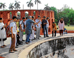 ENTHUSIASTS Children (above and below) learn about Jantar Mantar and its relevance.