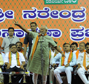 Gujarat Chief Minister Narendra Modi addresses a public rally in Bangalore on Sunday. DH Photo/Kishor Kumar Bolar
