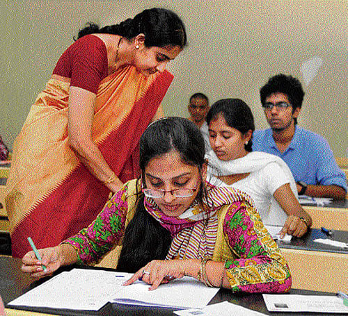 Attentive: Students write Common Entrance Test (CET) at a college in Bangalore on  Wednesday. DH Photo