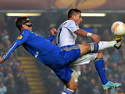 Chelsea's Spanish forward Fernando Torres (L) vies for the ball with FC Basel's German defender Markus Steinhoefer (R) during the Europa League semi-final second leg football match between Chelsea and FC Basel at Stamford Bridge in London on May 2, 2013. Chelsea won the match 3-1. AFP PHOTO