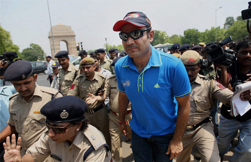 Cricketer Virender Sehwag takes part in a traffic awareness campaign in New Delhi on Wednesday. PTI Photo