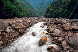 BIG BLOW: Water rushes through rocks at the site of a landslide in the Nu River gorge in China. NYT