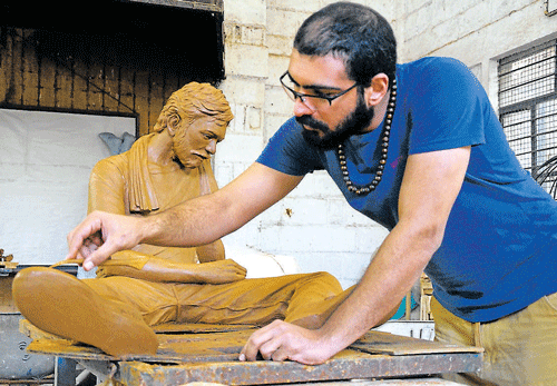 craftsmanship: Amir Moslemzadeh gives finishing touches to his sculpture DH Photos