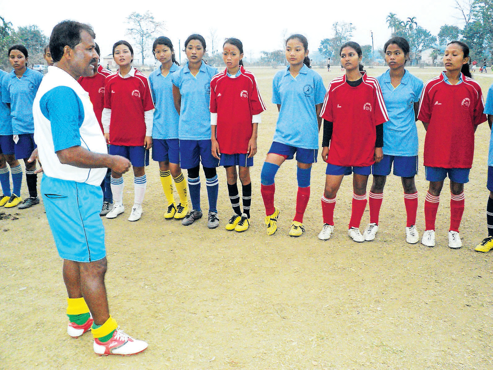 Just for kicks: Fourteen of Hem Das's coached sports stars are now part of the state's junior soccer team.