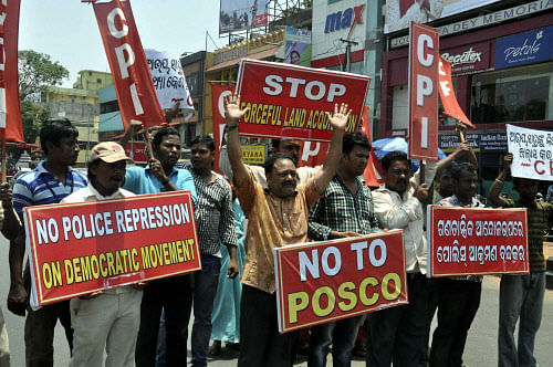 CPI activists stage a protest dempnstration against the arrest of the president of POSCO Pratirodha Sangram Samiti Abhaya Sahu in Bhubaneswar on Saturday. PTI Photo