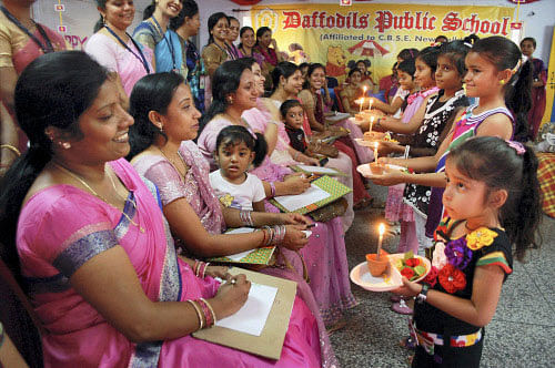 School children celebrate Mother's Day in Mirzapur on Saturday. PTI Photo