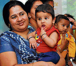 A woman and her child at a Mother's Day event in Bangalore on Saturday. DH photo