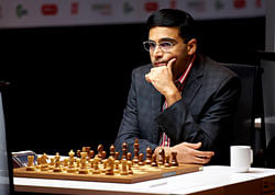 Anand plays against Norway's Carlsen in the Norway Chess 2013 tournament in Sandnes. Reuters