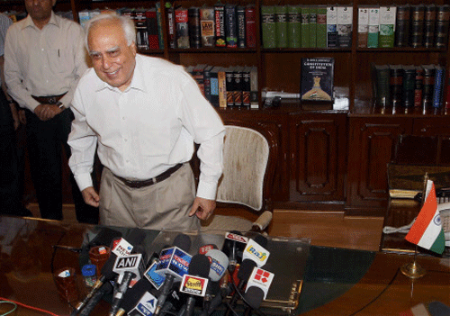 Union Minister for Communications and Information Technology Kapil Sibal taking additional charge of Law Ministry in New Delhi on Monday. PTI Photo by Manvender
